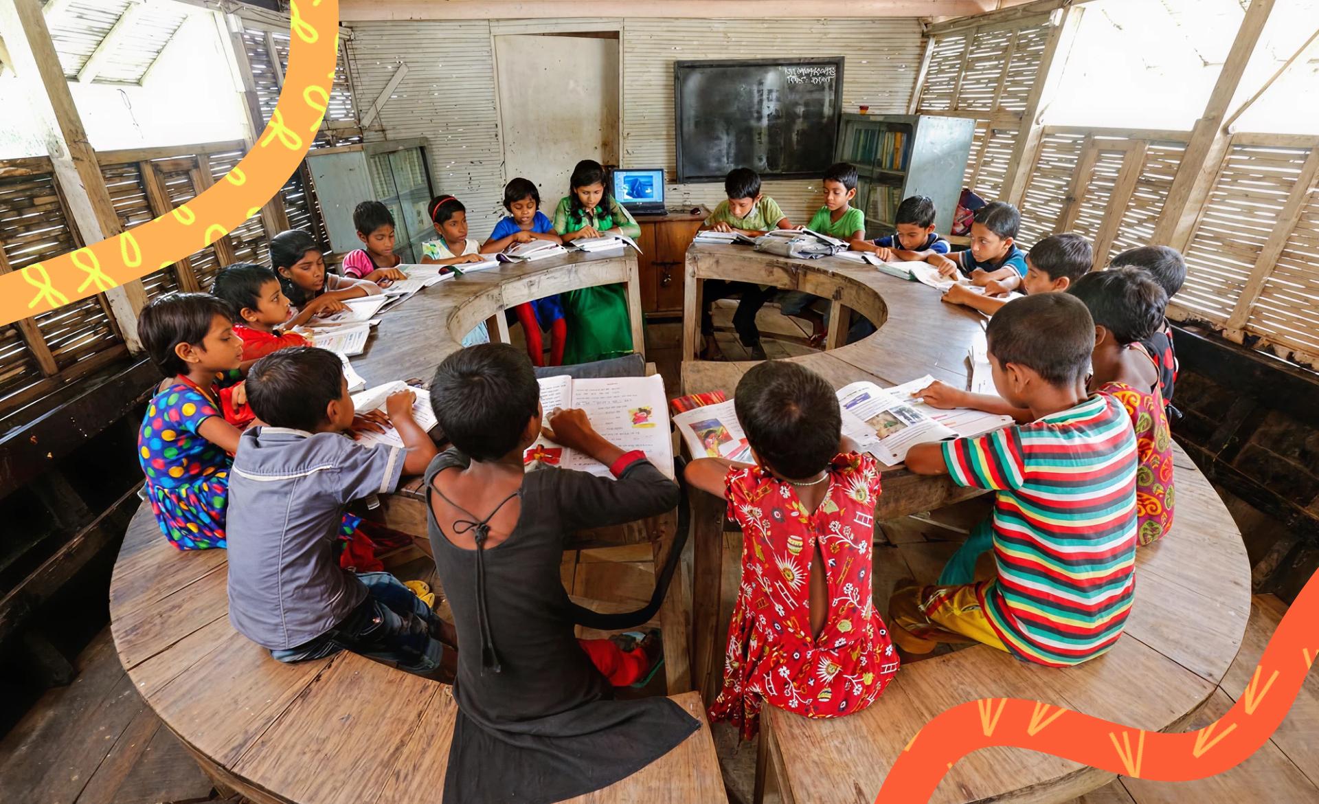 Group of Bangladeshi students sitting at a table in a circle