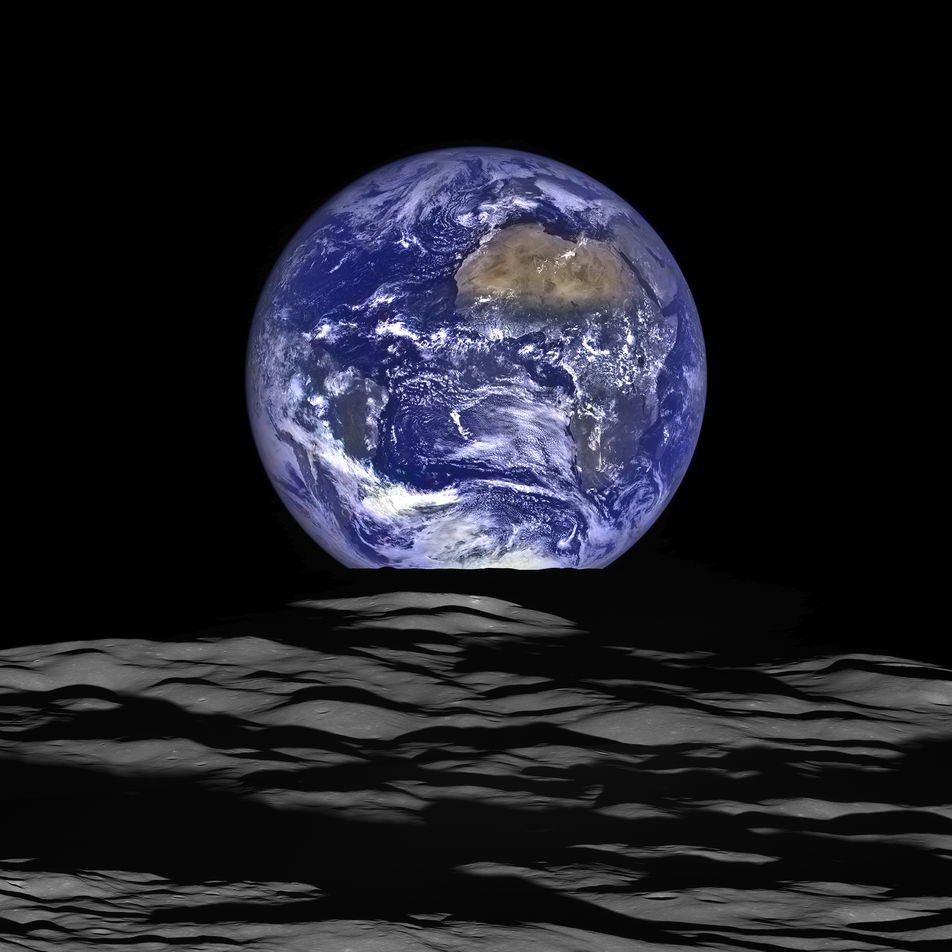 Photograph of the Earth rising above the surface of the Moon, taken from space
